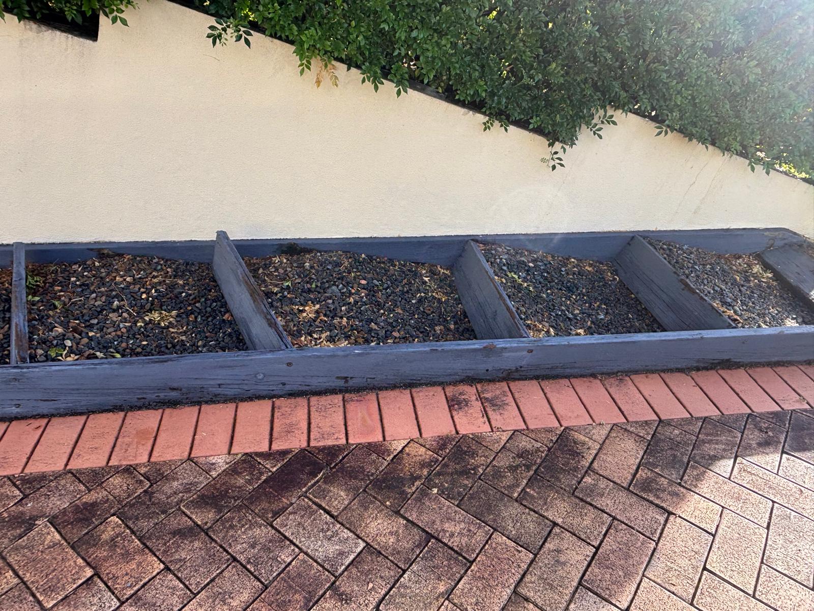 Timber garden edging and herringbone paving