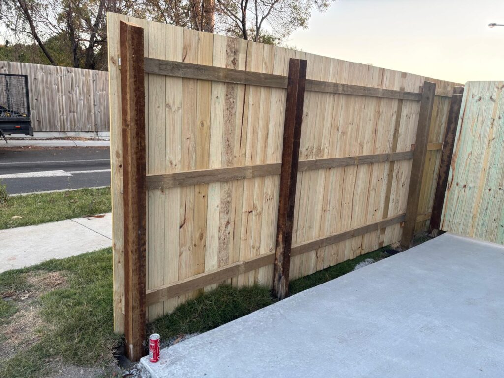 Rear face of the timber driveway gate showing posts and rails in Richlands
