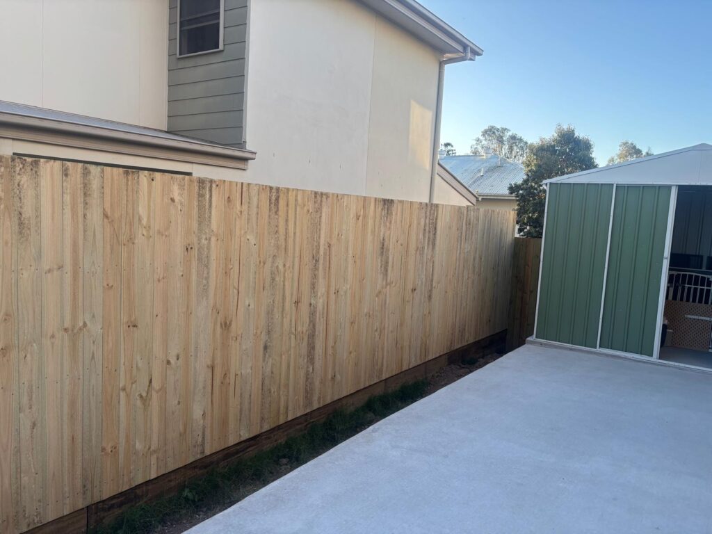 Timber side fence extending toward the garden shed in Richlands