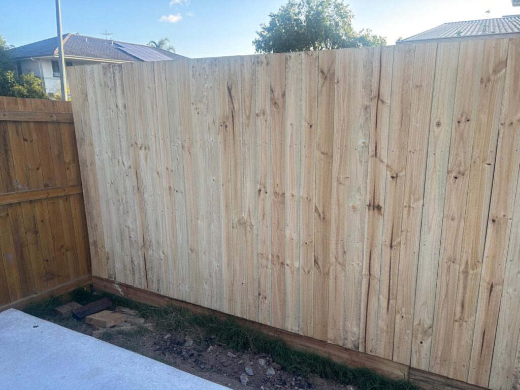 Timber boundary fencing meeting at the rear yard corner in Richlands