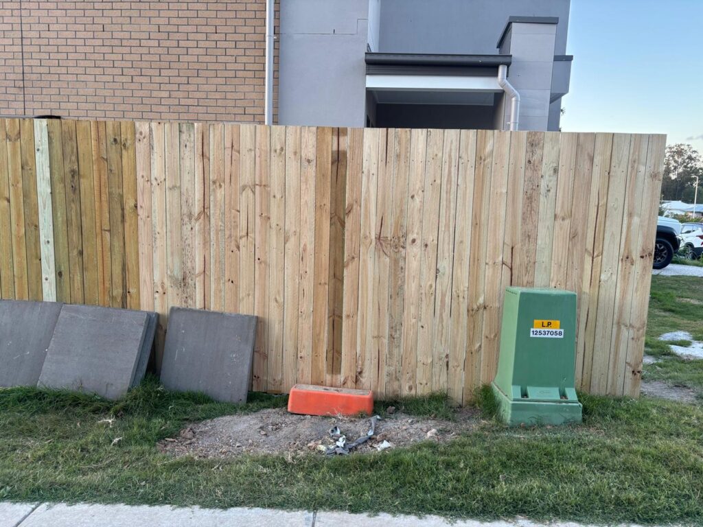 Timber side fence extension beside the brick home in Richlands