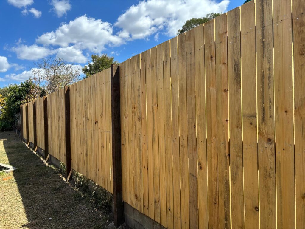Long view along the inside face of the timber fence in Jindalee