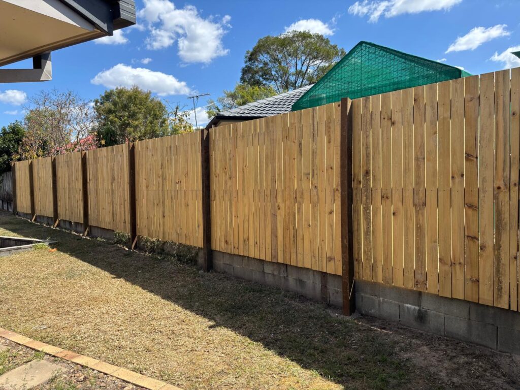 Wide garden view of the completed Hampton style timber fencing in Jindalee