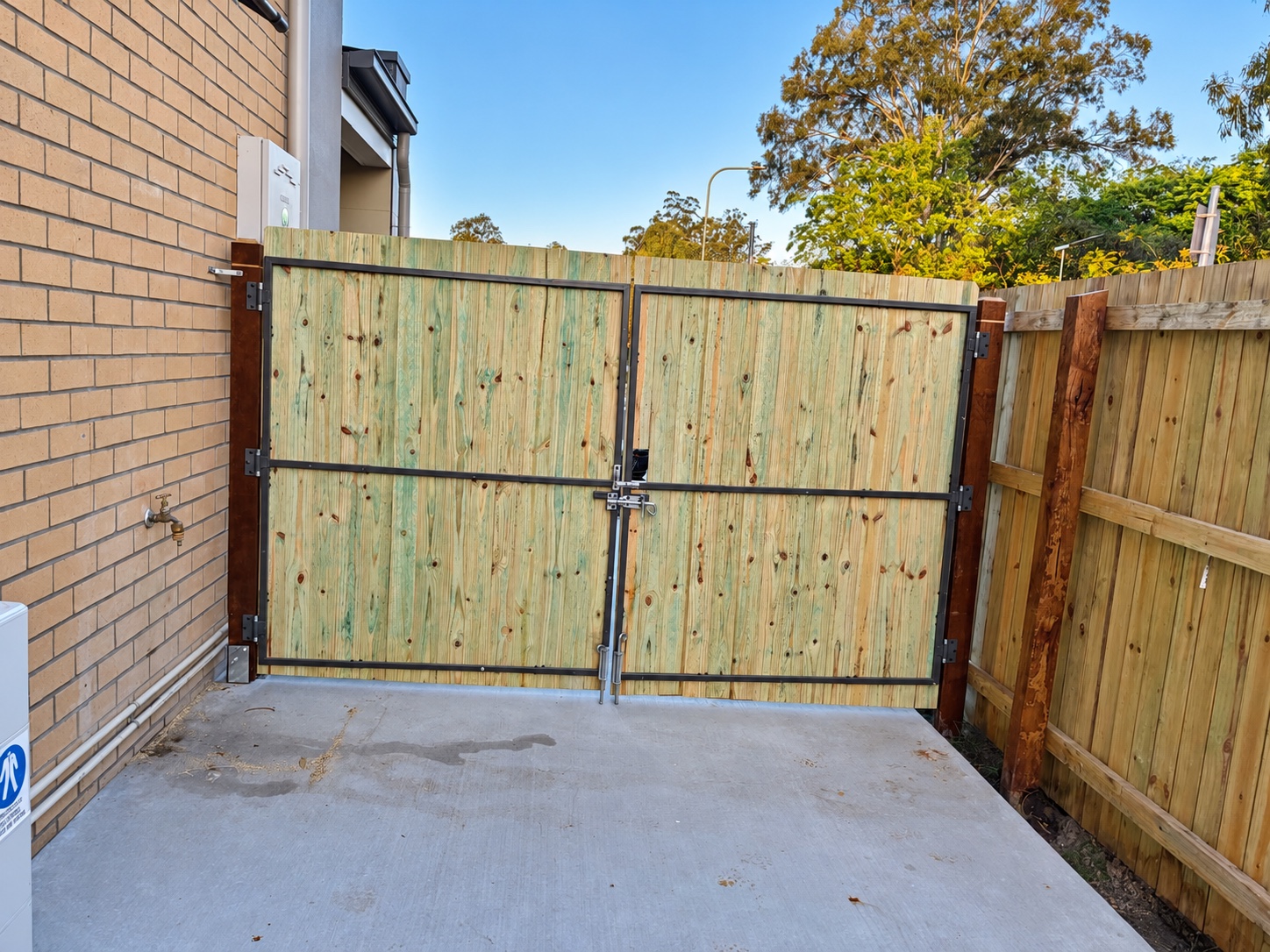 Custom double timber driveway gates and metal frames in Richlands
