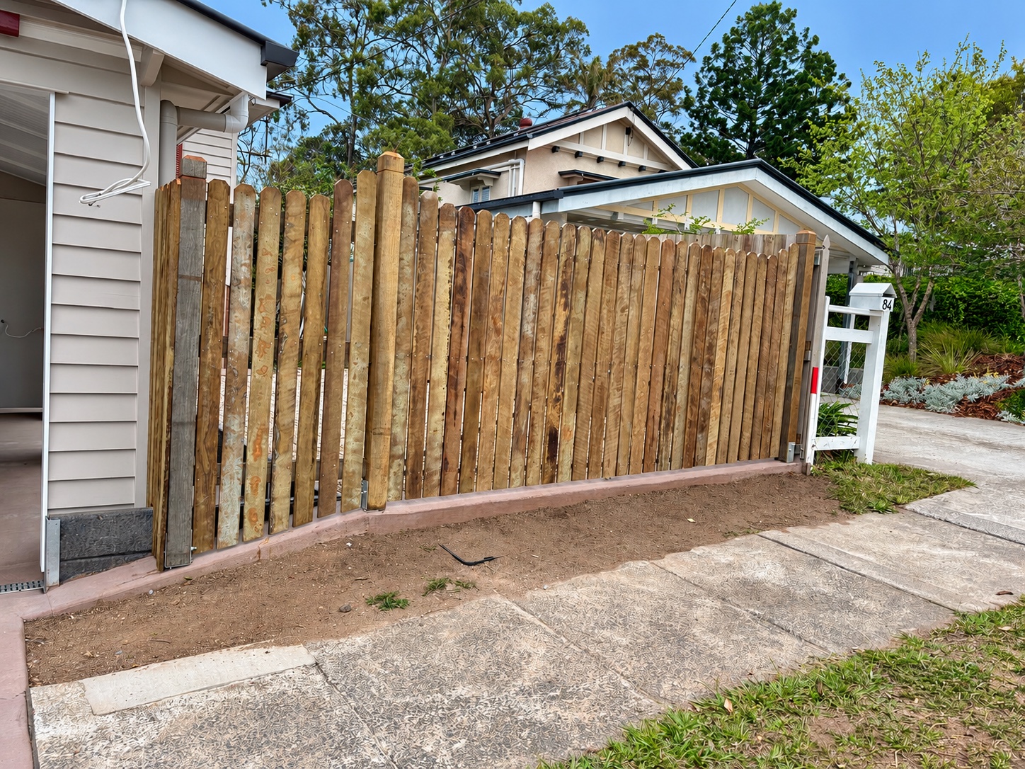 Hardwood timber frontage and custom driveway gates in Tarragindi